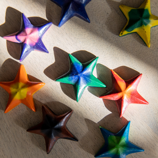 Eco-friendly 100% recycled star shaped multicolored swirl crayons in the morning light.